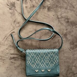Stella and Dot black and rose gold mini sidekick Crossbody clutch